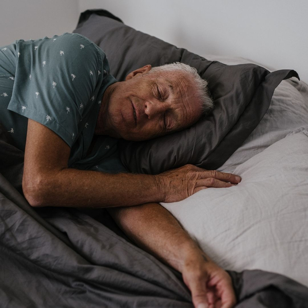 man sleeping in bed 