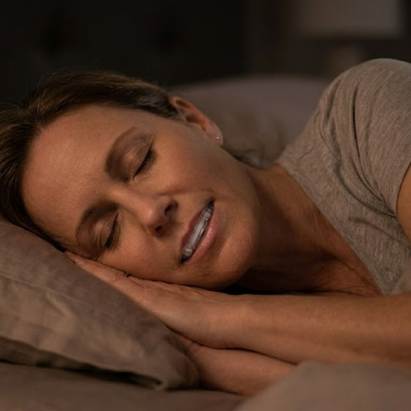 person sleeping with oral appliance device 