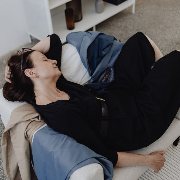 tired woman on the couch