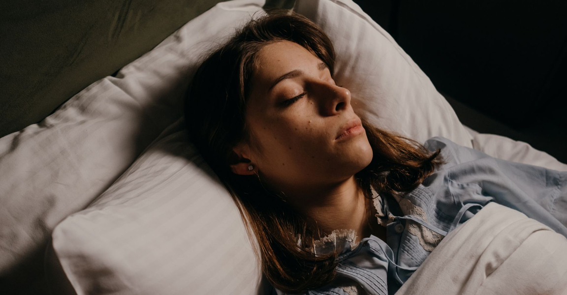 Woman sleeping peacefully in bed