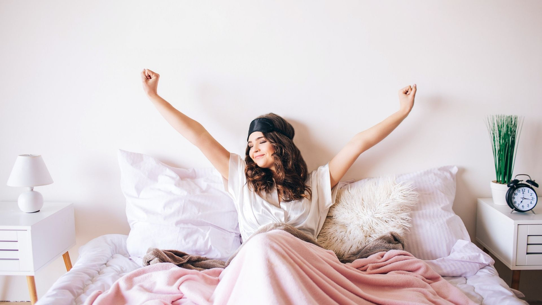 woman stretching waking up well rested
