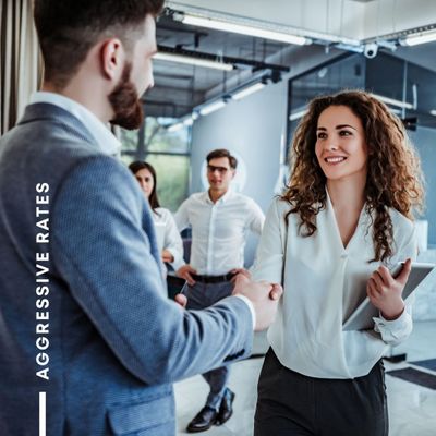 Two professionals shaking hands in an office. Two professionals shaking hands in an office.