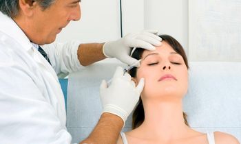 a doctor injecting Botox in a patient