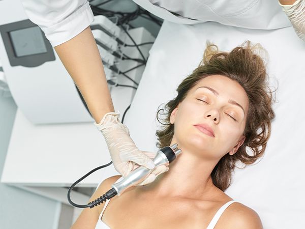 a woman getting a neck treatment