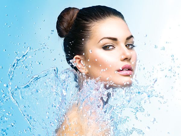 a model being splashed with clean water