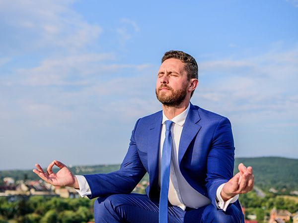 a man in a suit meditating