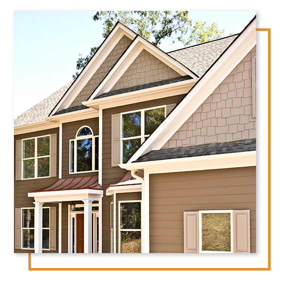 Brown freshly painted home with peaks