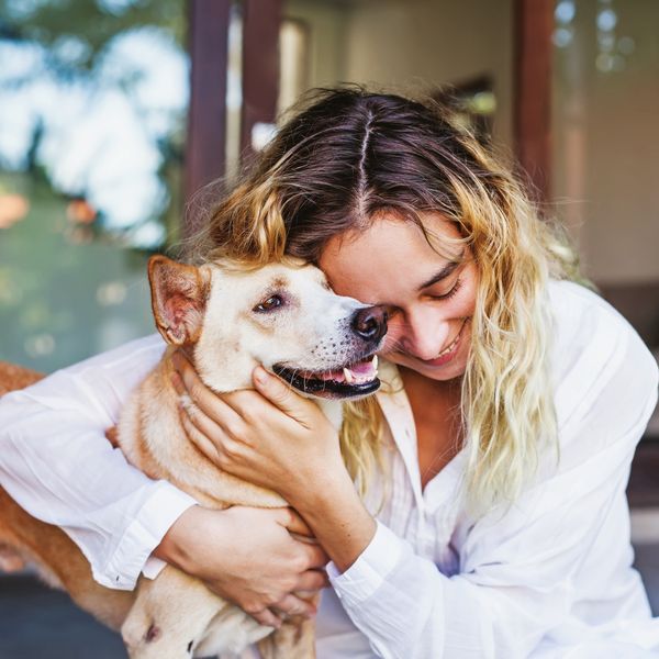 image of a woman hugging a dog