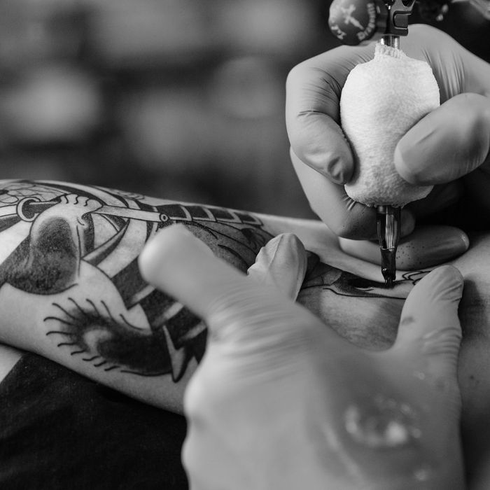 Arm being tattooed