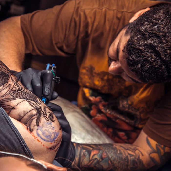 Man tattooing