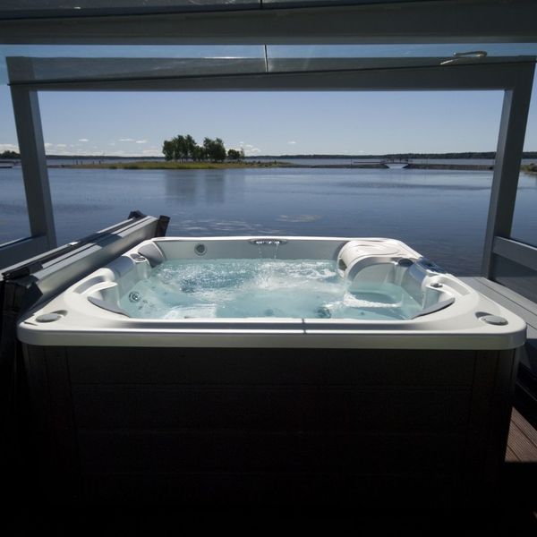 Hot tub installed next to lake