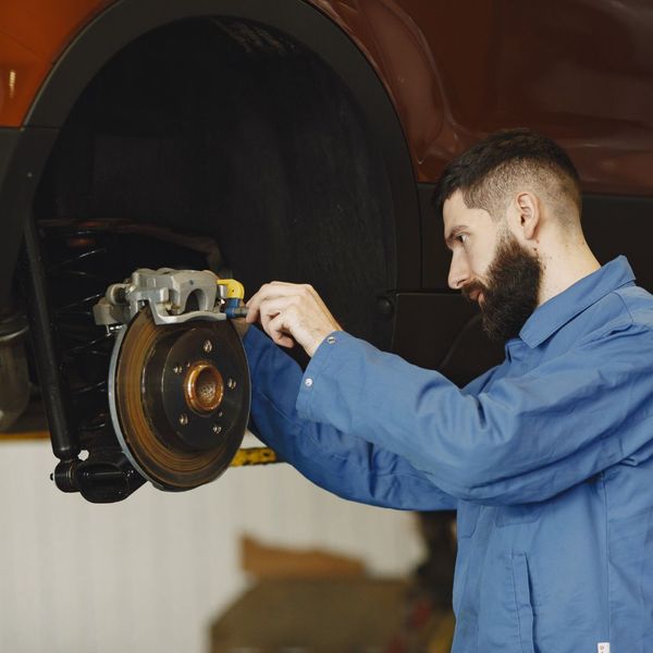 mechanic working on a car