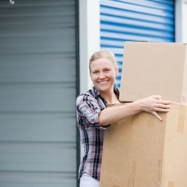 Woman smiling with boxes