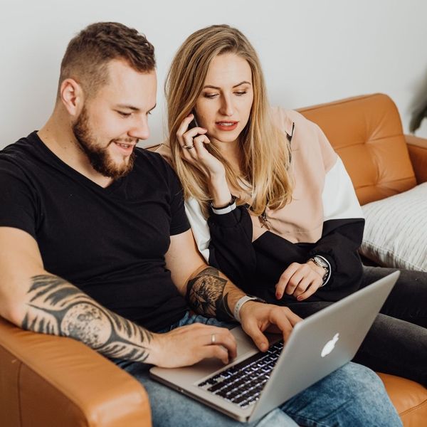 couple looking at bids on a computer couple looking at bids on a computer