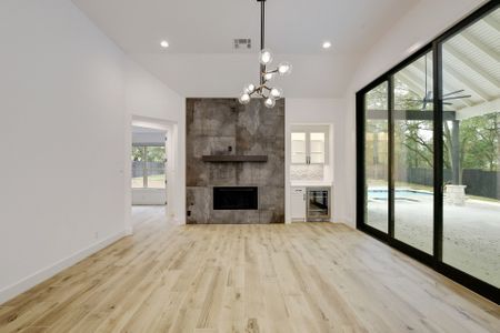 Direct shot of the fireplace and wine fridge.jpg